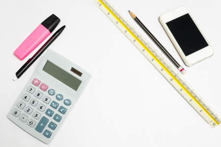 Isolated office tool on white background - pen, highlight pen, cellphone; ruler, pencil and calculatorの写真素材