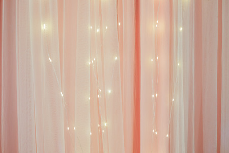 Pink curtain texture and led bulb as backgroundの写真素材