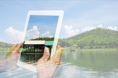 People only see nature through digital device like tablet pc or touch pad even if real nature is all around themの写真素材