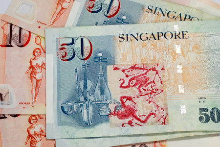50 and 10 Singapore dollar bills texture as backgroundの写真素材