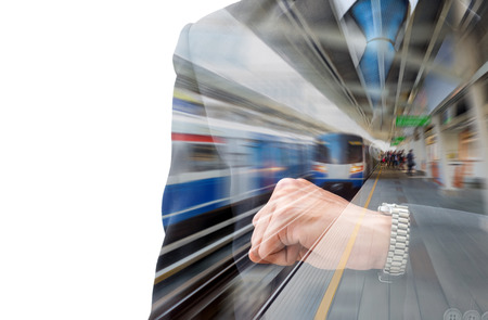 Double exposure businessman looking his watch to check time and motion blur train station. Look like his is in a hurry in rush hour and traffic is so bad.のeditorial素材