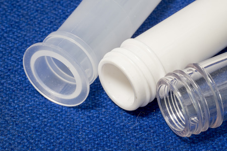 Thread and sealing mouth PET and PP plastic preform for stretch blow molding to bottle on blue...