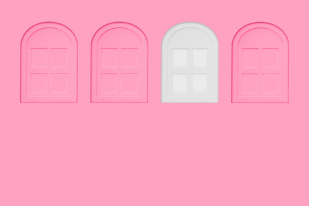 White window between pink windows on pastel pink wall for copy space. Difference minimal concept.の写真素材