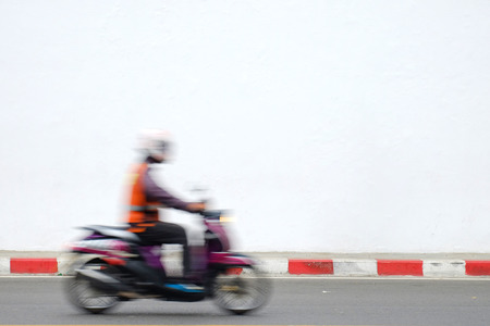 Motion blur bike rider on the street with fast speed.の写真素材