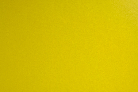 Yellow concrete wall for interior and exterior decoration background.の写真素材