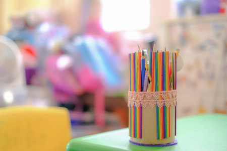 Pastel color pencils in basket holder for kids and children.の写真素材