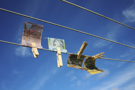 Australian money notes pegged on washing line. Money laundering concept.
