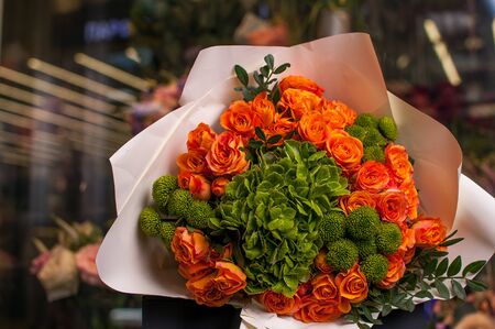 Beautiful Bouquet. Spring flowers in the cold dark room of the flower shopの写真素材