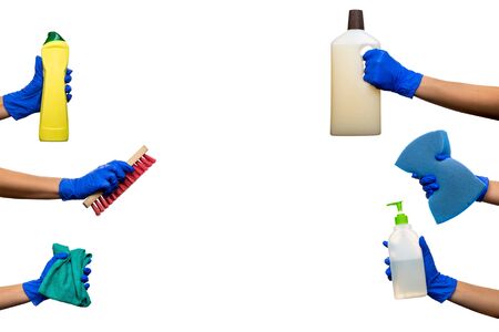 Hand in a blue glove with plastic beige, yellow bottle floor cleaner, blue cleaning sponge, red cleaning brush, green rag. Cleaning Products and Supplies. Isolated white backgroundの写真素材