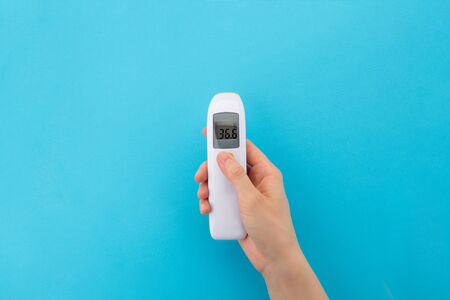 Infrared non-contact thermometer for temperature measurement. The concept of an electronic device to check Your healthの写真素材