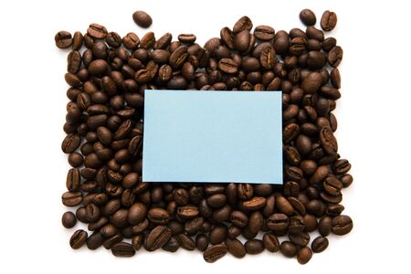 Mockup of a blue note on a solid background of many coffee beans. Isolated on a white background, copy space for textの写真素材