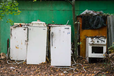 Several refrigerators scrap metal, household . Damaging the planet's ecology with garbageの写真素材