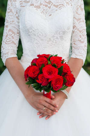 Beautiful Bridal red bouquet. The concept of wedding, traditionsの写真素材