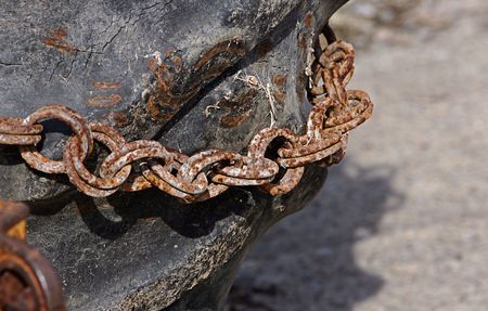 rusty chain on a tractor wheelの写真素材