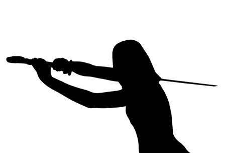 silhouette over white of a female MMA student posing with a sword over whiteの写真素材