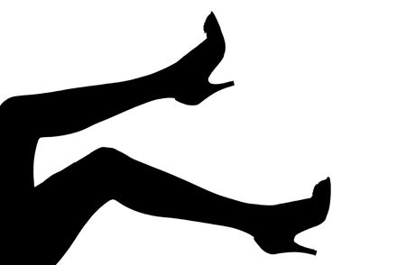 a silhouette of women's legs in high heels over whiteの写真素材