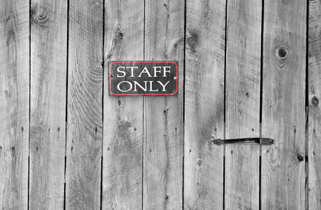 staff only sign on an old wooden door の写真素材