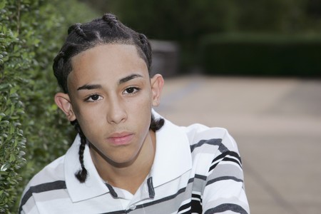 outdoor portrait of one young teen boy near a pathの写真素材