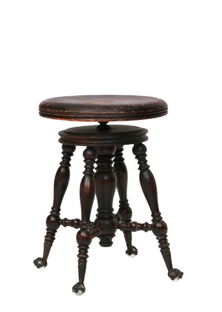 one old antique wooden stool with glass feet over whiteの写真素材