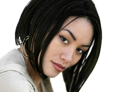 one pretty young adult woman closeup headshot portrait over whiteの写真素材