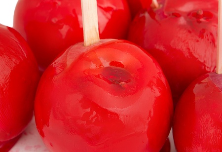 group of red candied apples with a white backgroundの写真素材
