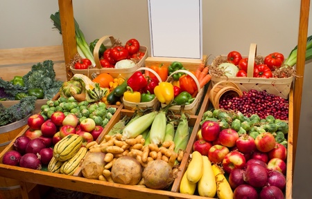 large harvest of fruits and vegetables with a blank signの写真素材
