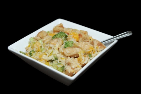 close up bowl of ginger orange chicken with broccoli and soy sauceの写真素材