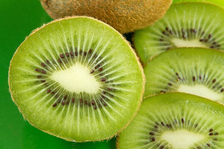 group of kiwi fruit slices covering a backgroundの写真素材