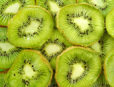 group of kiwi fruit slices covering a backgroundの写真素材