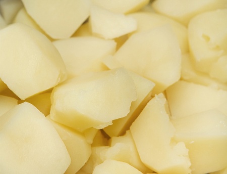 large group of cut and cooked potatos ready to eatの写真素材