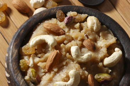 Atte ji sero is flour based dessert made with wheat flour, ghee and dry fruitsの写真素材