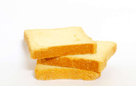 three slices of toasted bread one on top of the other on a white background