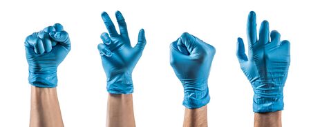Some hands with blue latex glove making different gesturesの写真素材