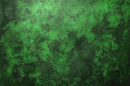 Green weathered wall textured background with emerald tones. Aged wall.の写真素材
