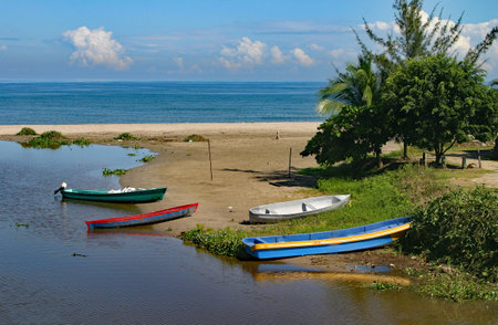 Colorful boats docked on the Pacific coast wait for the high tide.の写真素材