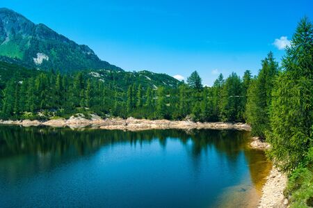 landscape of mountain with tree lake and clouds