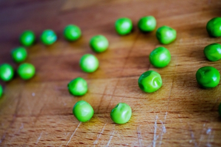 Macro from peas on a wood tableの写真素材