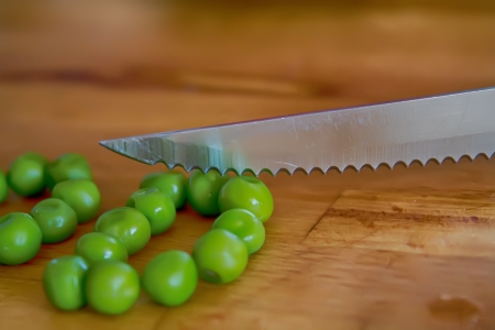 Macro from peas with a metal knifeの写真素材
