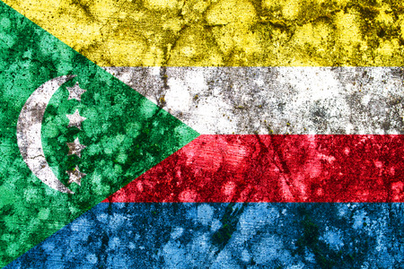 Old comoros grunge flag painted on a wallの写真素材