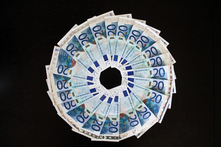 Twenty euro banknotes on black backgroundの写真素材