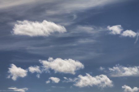 Clouds on a blue sky in a sunny dayの写真素材