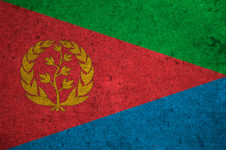 Eritrea flag on an old grunge backgroundの写真素材