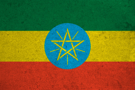 ethiopia flag on an old grunge backgroundの写真素材