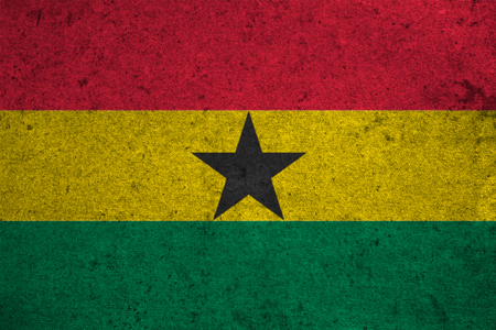 ghana flag on an old grunge backgroundの写真素材