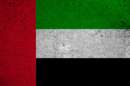 The United Arab Emirates flag on an old grunge backgroundの写真素材