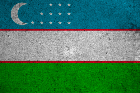Uzbekistan flag on an old grunge backgroundの写真素材