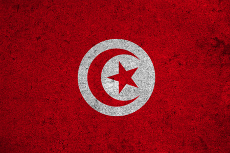 Tunisia flag on an old grunge backgroundの写真素材
