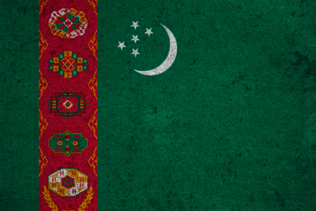 Turkmenistan flag on an old grunge backgroundの写真素材
