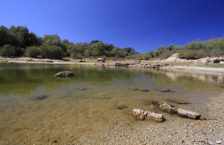 Clean and calm water dam on a summer afternoon in the Alentejo in Portugal.の写真素材