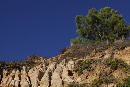 Cliff with rocks under blue skiesの写真素材